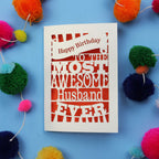 Husband Birthday card for the most awesome husband ever on a blue background with colourful pom-poms.