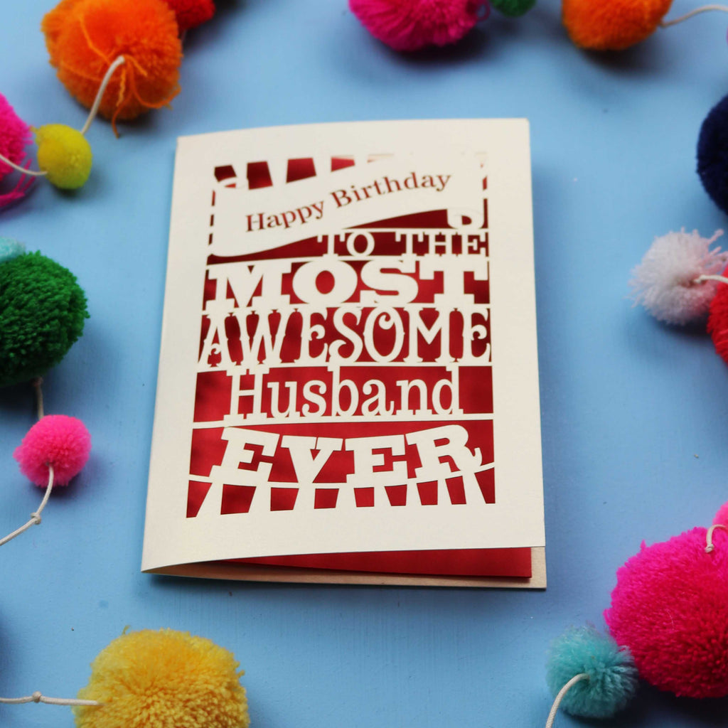 Special Husband Birthday card for the most awesome husband ever on a blue background with colourful pom-poms.
