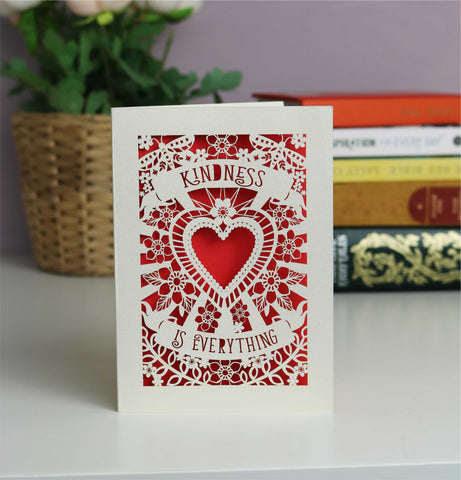 Beautiful lasercut "Kindness is everything" card. Shows a cut out heart surrounded with flowers, butterflies and banners containing the text. Shown here in cream card with red inset paper. - A5 (large) / Bright Red