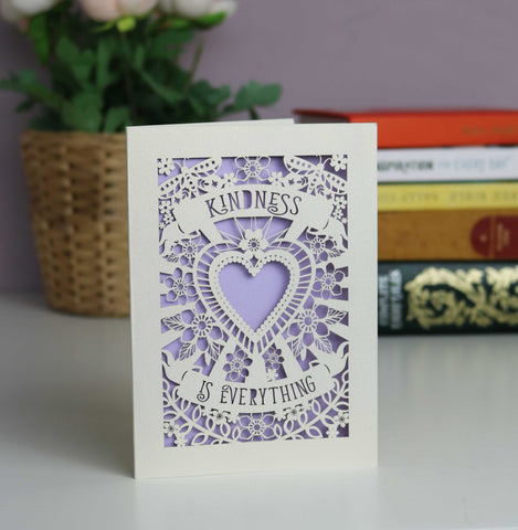 Lasercut "Kindness is everything" card with a central heart, flowers and butterflies. Two banners with the text. Shown here in cream card with a lilac insert. - A5 (large) / Lilac