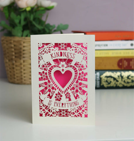 Lasercut cream and shocking pink Kindness is everything card. Flowers, butterflies and a large heart with two banners containing the text. - A5 (large) / Shocking Pink