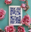Laser cut Valentines Card for men, with decorative king of hearts cut-out design and text on a green background with colourful roses.