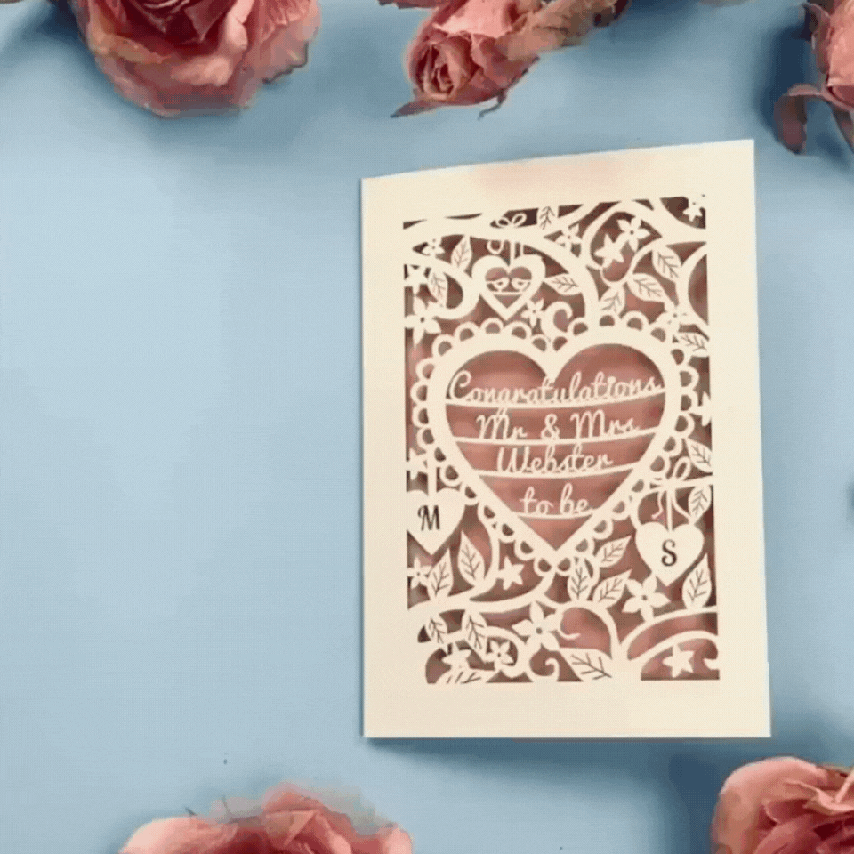 a stop motion video of a laser cut engagement card opening and closing