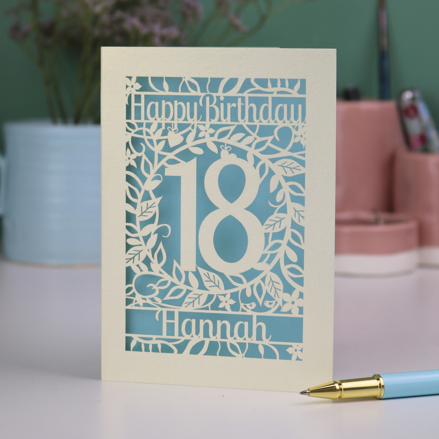 Laser cut Birthday card with 'Happy Birthday 18 Hannah' on a blurred background
