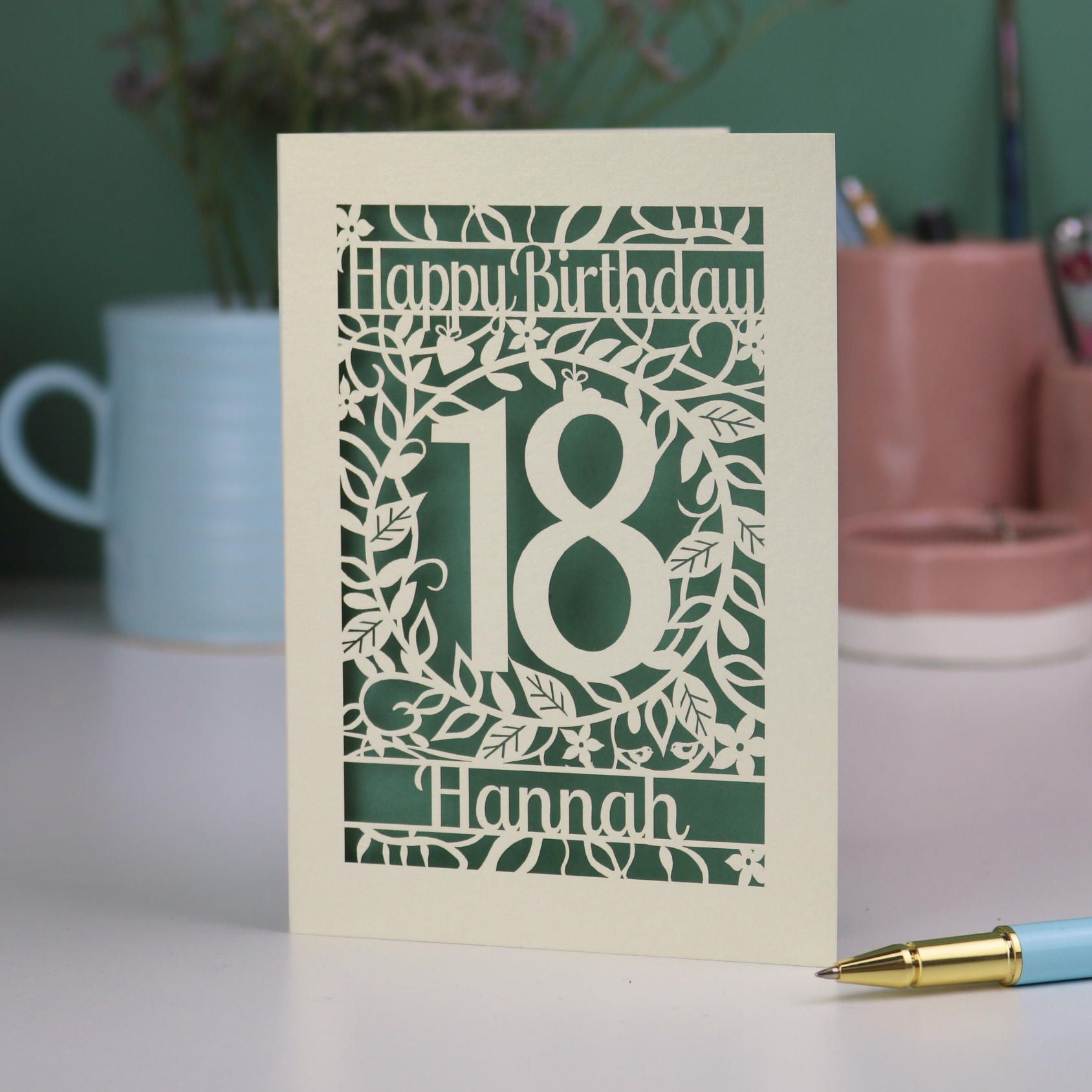 Laser cut Birthday card with 'Happy Birthday 18 Hannah' on a blurred background