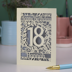 Laser cut Birthday card with 'Happy Birthday 18 Hannah' on a blurred background