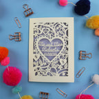 Decorative card with personalized text on a blue background with decorative items