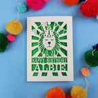 Special 1st Birthday card with lion design and colourful pom-poms on a blue background