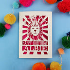Special 1st Birthday card with lion design and colourful pom-poms on a blue background