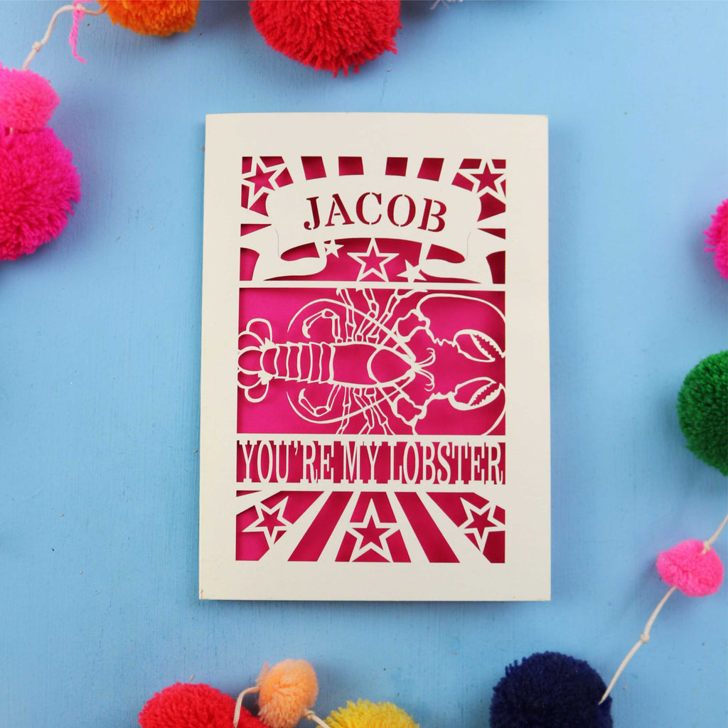Lobster Valentine's Card with 'Jacob, you're my lobster' design on a blue background with colourful pom-poms.
