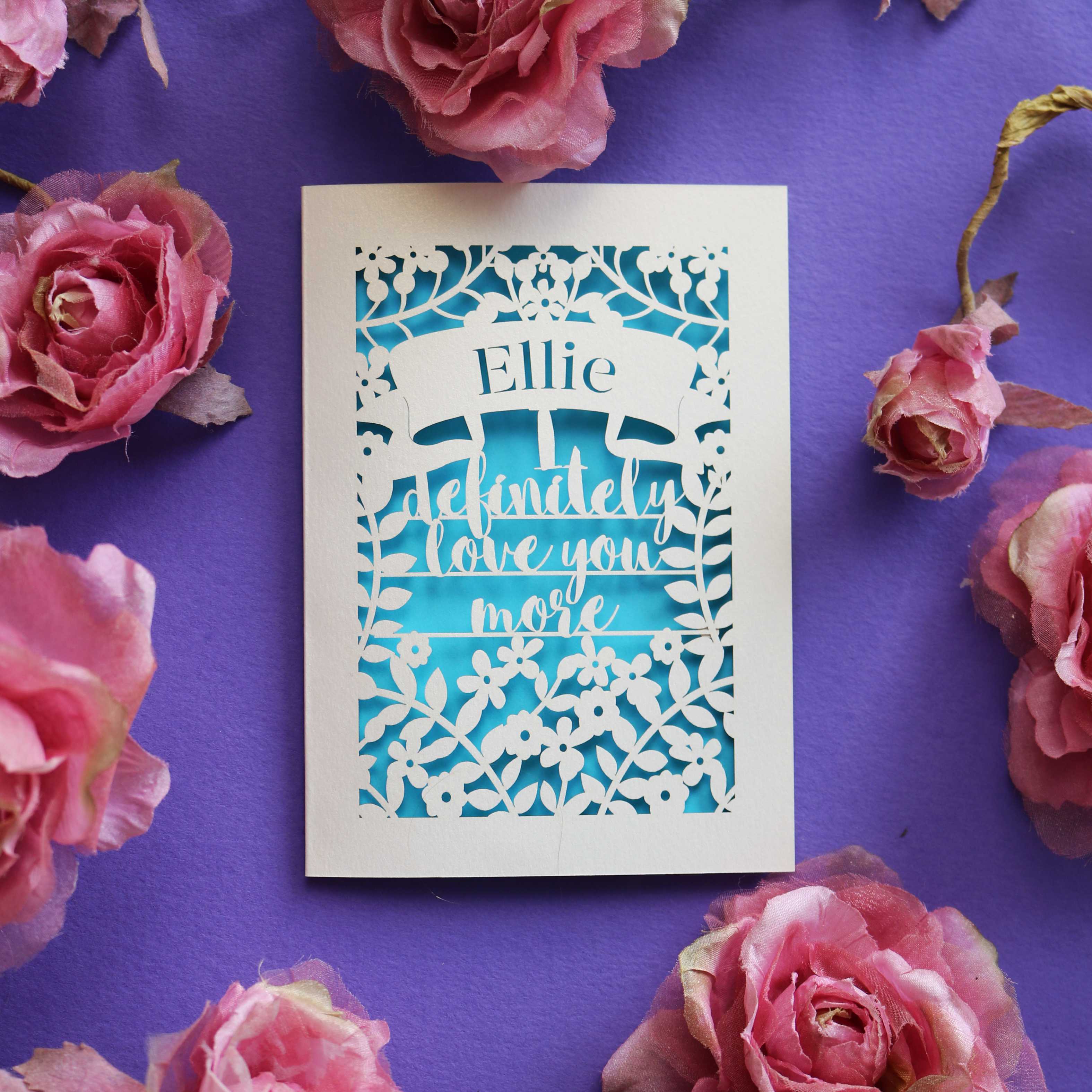 A personalised Valentine's card that says "I definitely love you more"