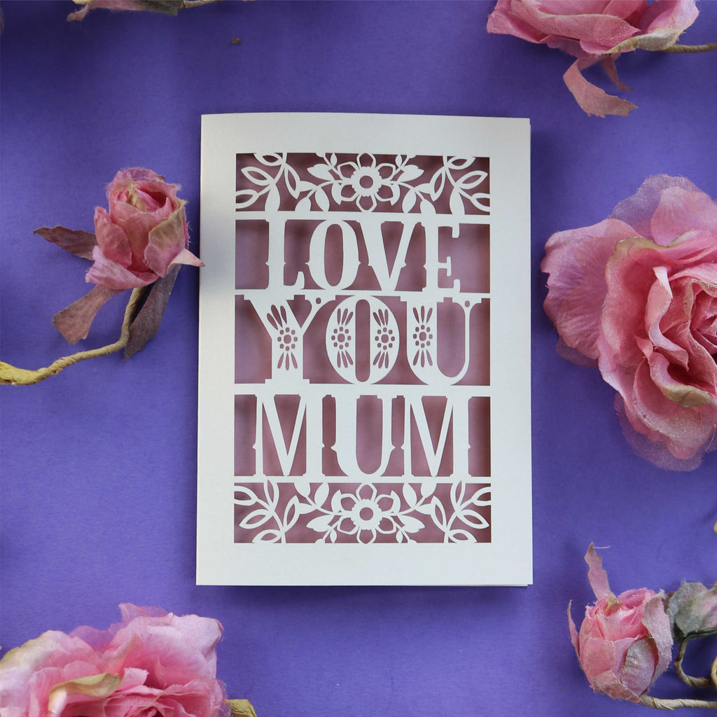 A cream and dusky pink Mother's Day card, laser cut with the words "Love you mum"