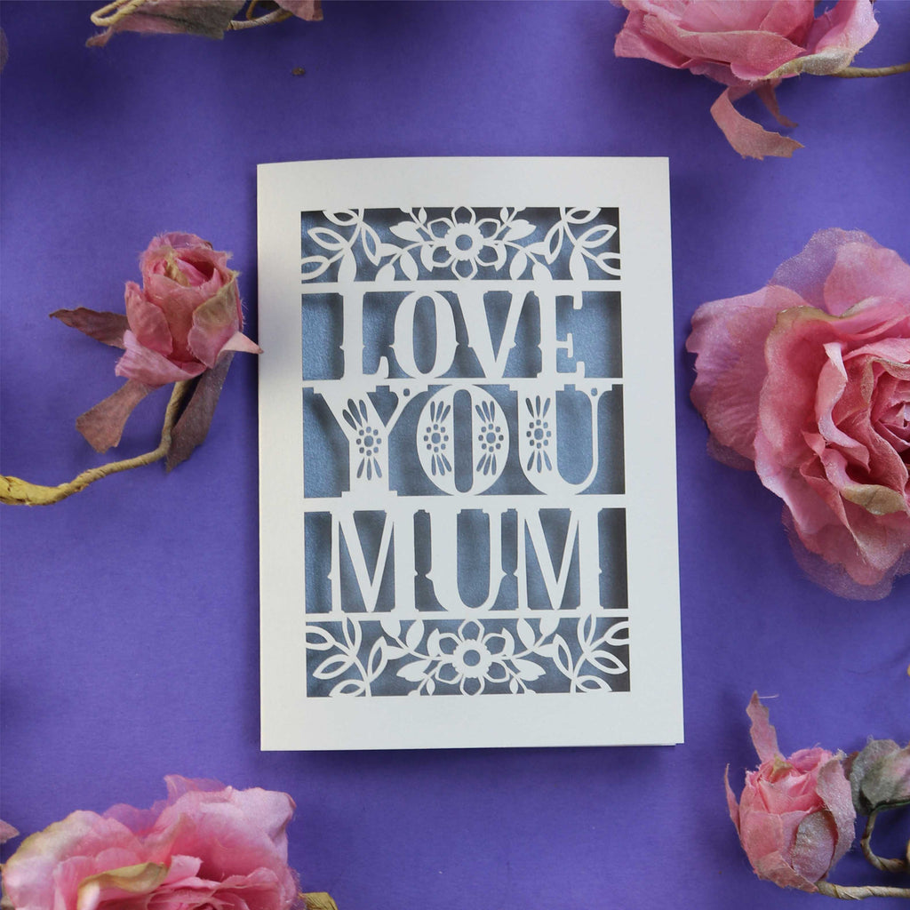 A cream and silver Mother's Day card, laser cut with the words "Love you mum"