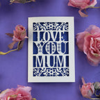 A cream and violet Mother's Day card, laser cut with the words "Love you mum"