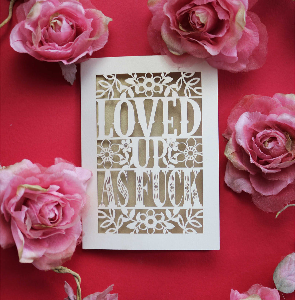 A papercut Valentine's card that says "Loved up as fuck"