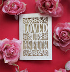 A papercut Valentine's card that says "Loved up as fuck"