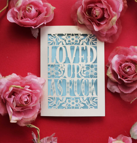 A paper cut Valentine's card that says "Loved up as fuck" - A6 (small) / Light Blue