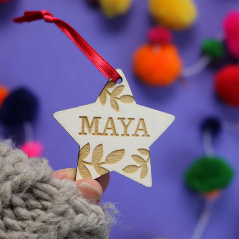 A personalised wooden star personalised Christmas decoration - 