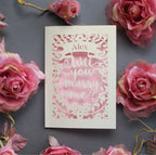 A personalised proposal card, laser cut from cream card with a candy pink paper behind