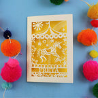 Personalised birthday Card with carousel design and 'FREYA' text on a blue background with colourful pom-poms.
