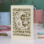 Laser cut moon 18th Birthday card with blue star and moon design on a desk with stationery items.
