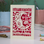 Laser cut moon 18th Birthday card with blue star and moon design on a desk with stationery items.