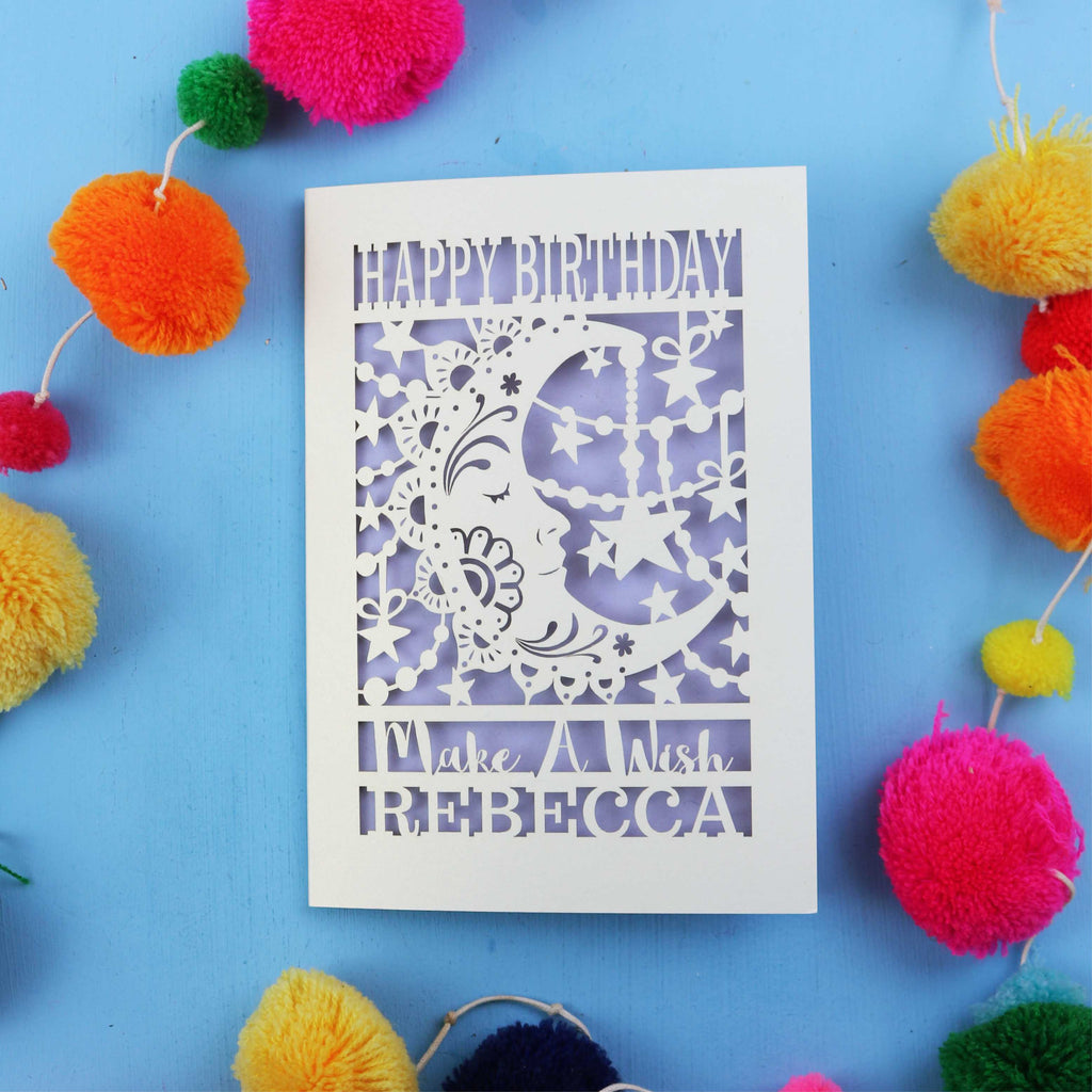 Personalised papercut Birthday card with decorative elements on a blue background
