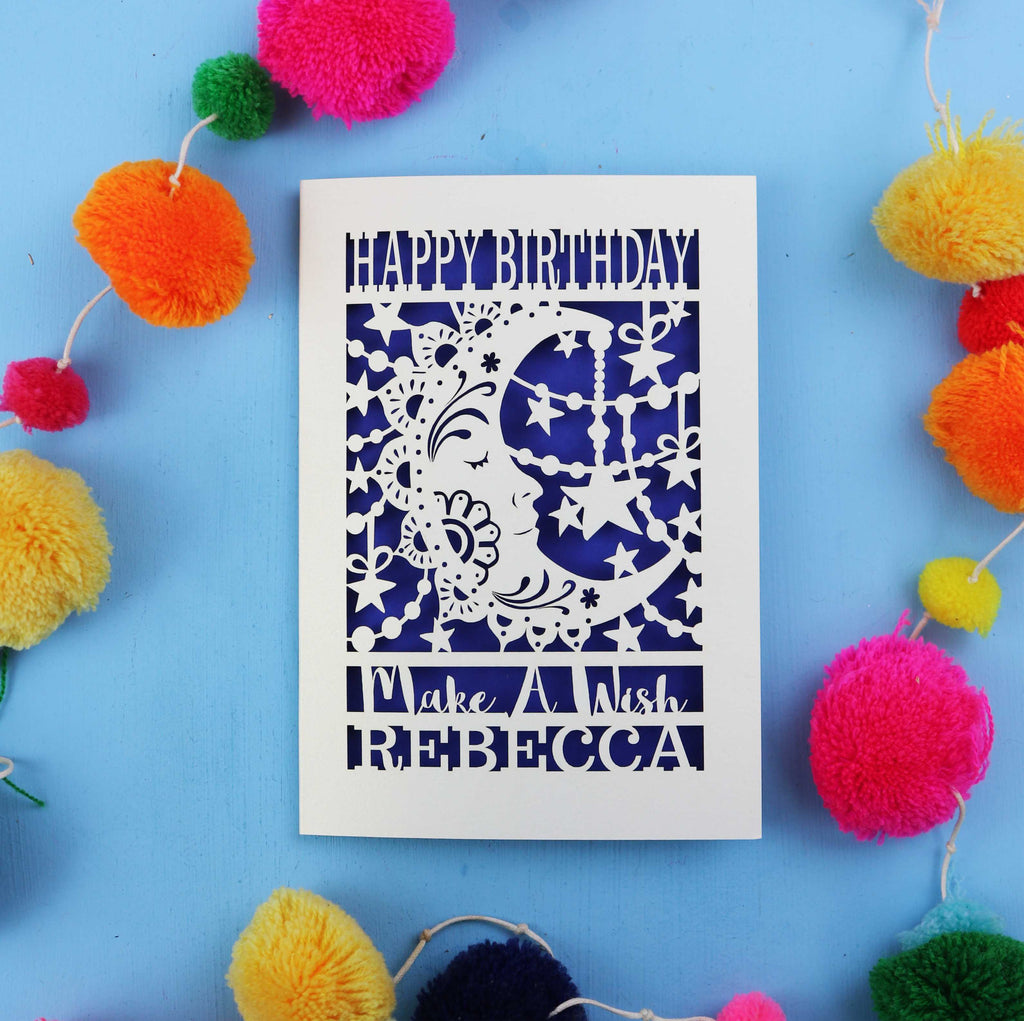 Personalised laser cut Moon Birthday card with decorative elements on a blue background