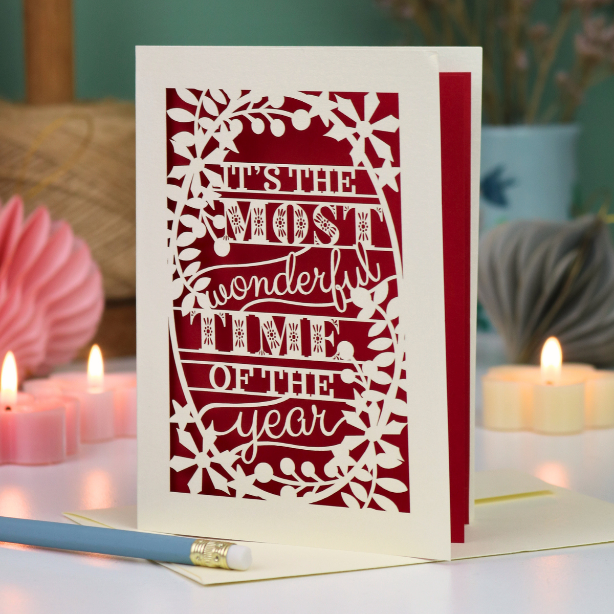 A laser cut Christmas card in cream with decorative text, 'It's the most wonderful time of the year'
