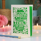A laser cut Christmas card in cream with decorative text, 'It's the most wonderful time of the year'