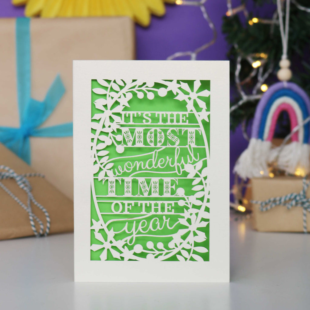 Decorative laser cut Christmas card with 'It's the most wonderful time of the year' text 
