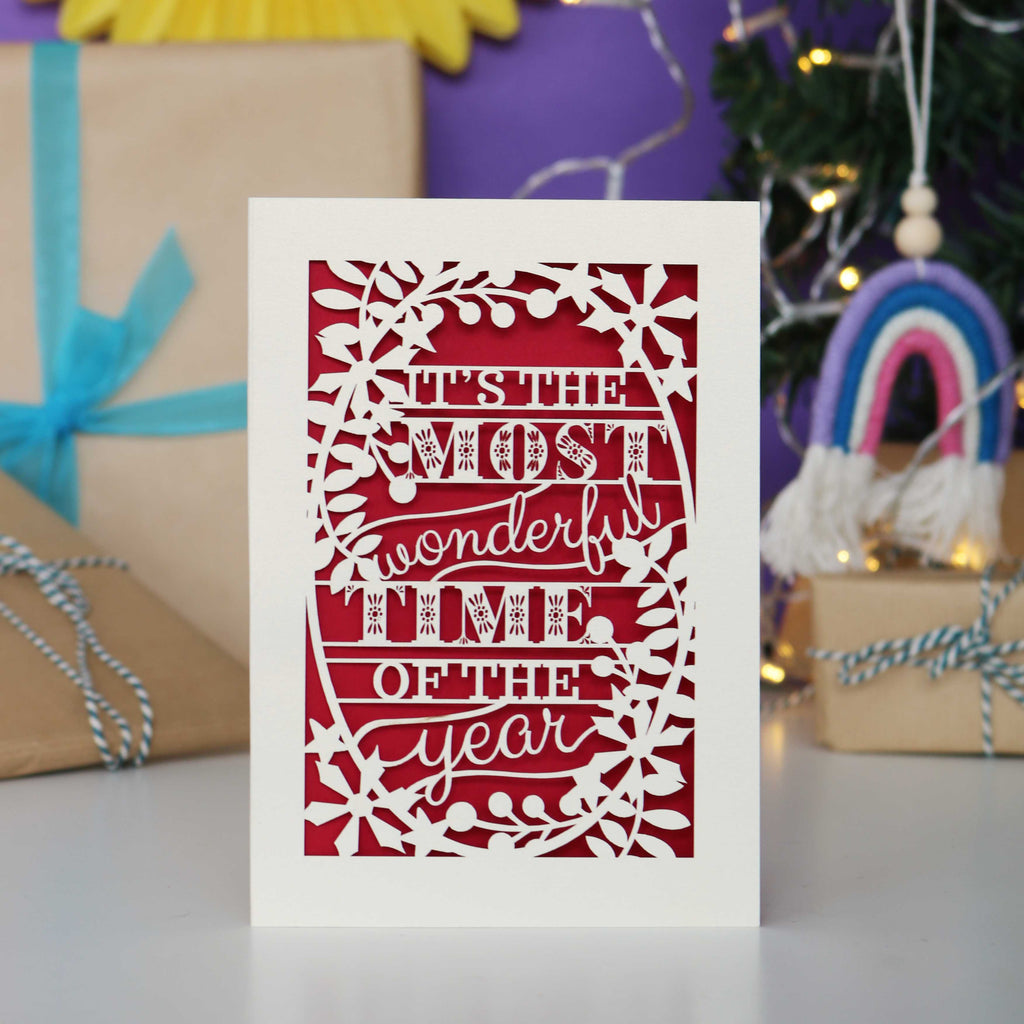 Decorative laser cut Christmas card with 'It's the most wonderful time of the year' text 