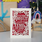 Decorative laser cut Christmas card with 'It's the most wonderful time of the year' text 