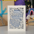 Decorative laser cut Christmas card with 'It's the most wonderful time of the year' text 
