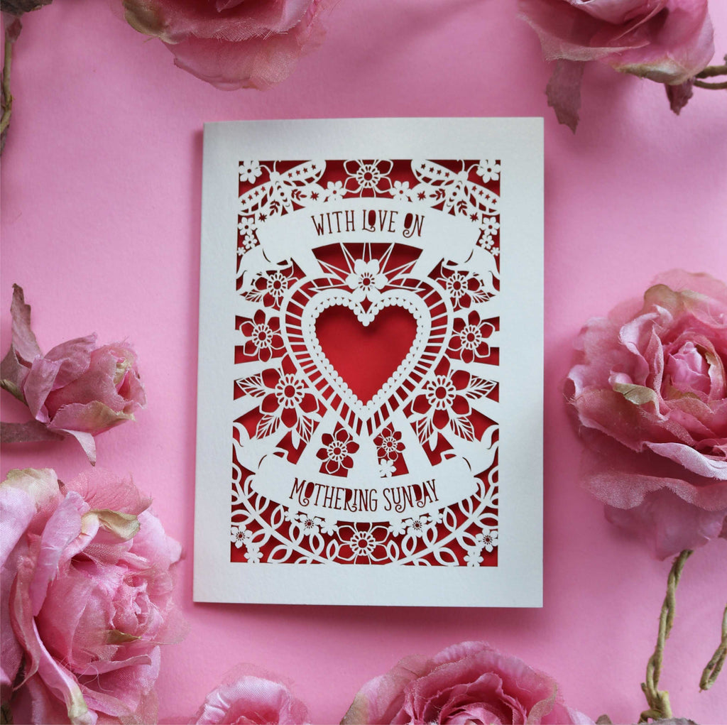 A cream cut out Mother's Day card that says "With love on Mothering Sunday" and a red paper insert to show laser cut details