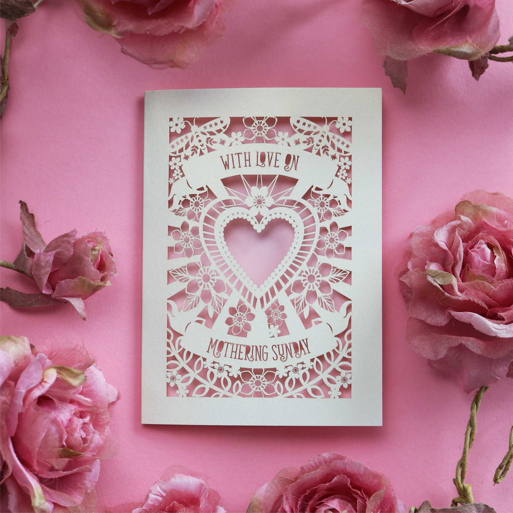 A cream cut out Mother's Day card that says "With love on Mothering Sunday"