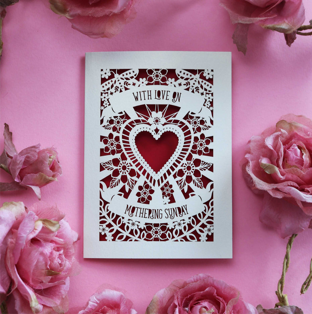 A cream and dark red laser cut Mother's Day card that says "With love on Mothering Sunday