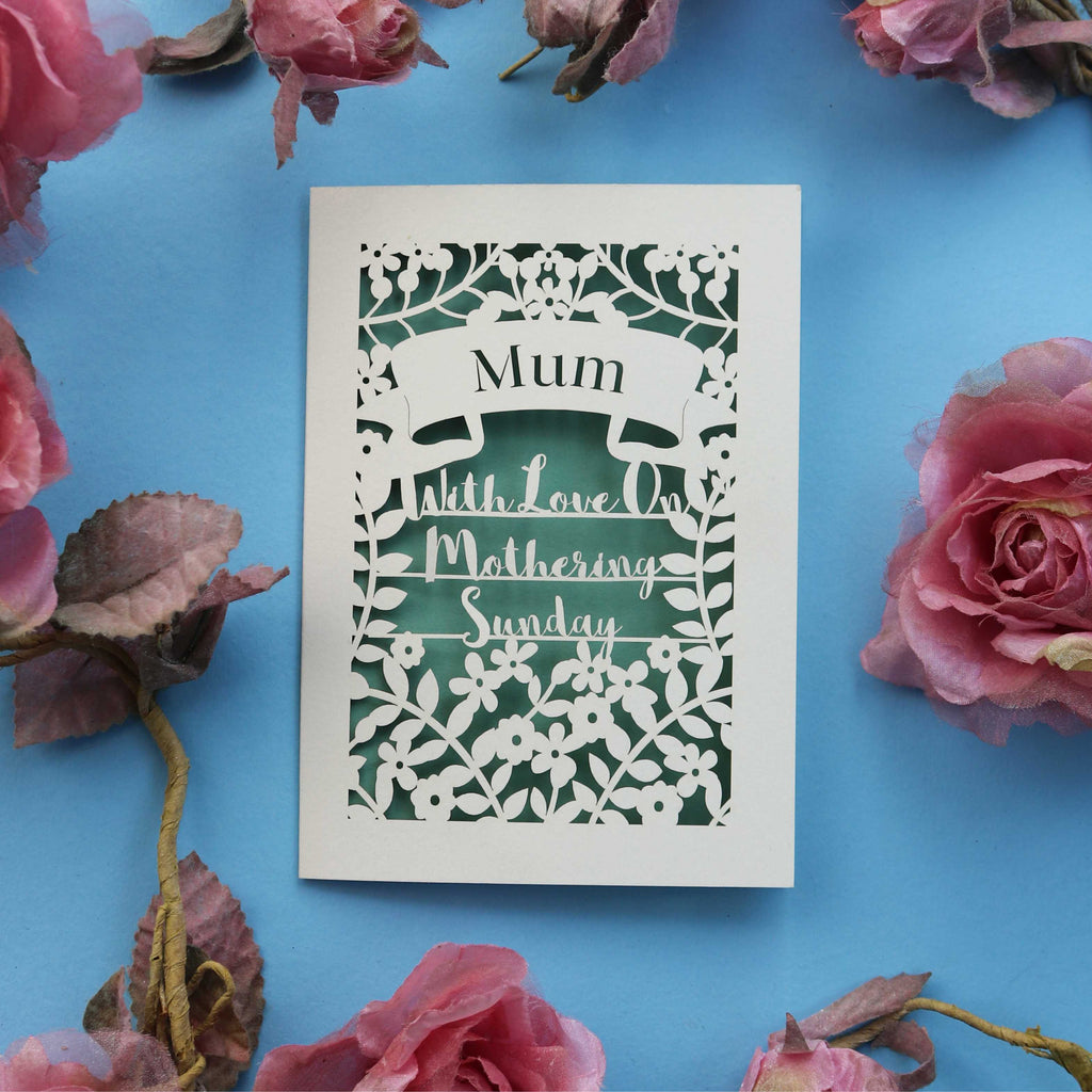 A cut out Mother's Day card that says "Mum, With love on Mothering Sunday"