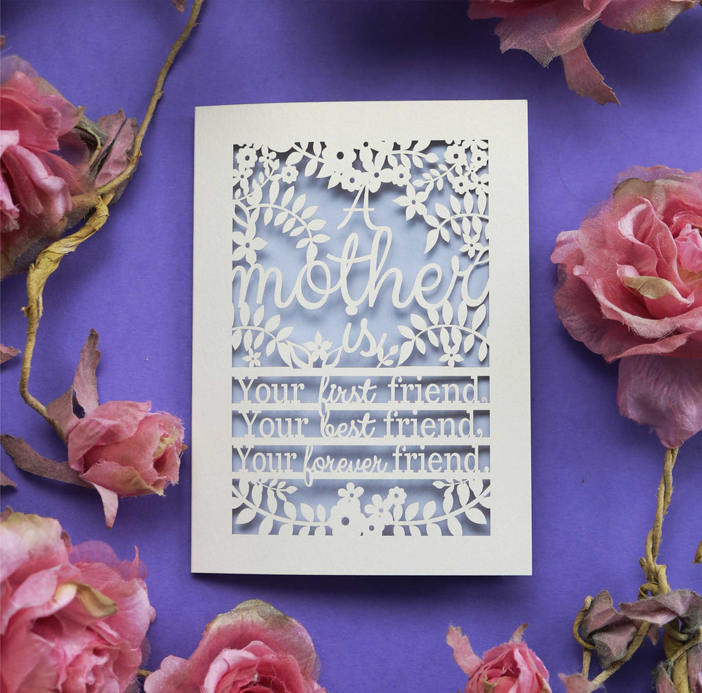 A laser cut Mum card that says "A mother is your first friend, your best friend, your forever friend."