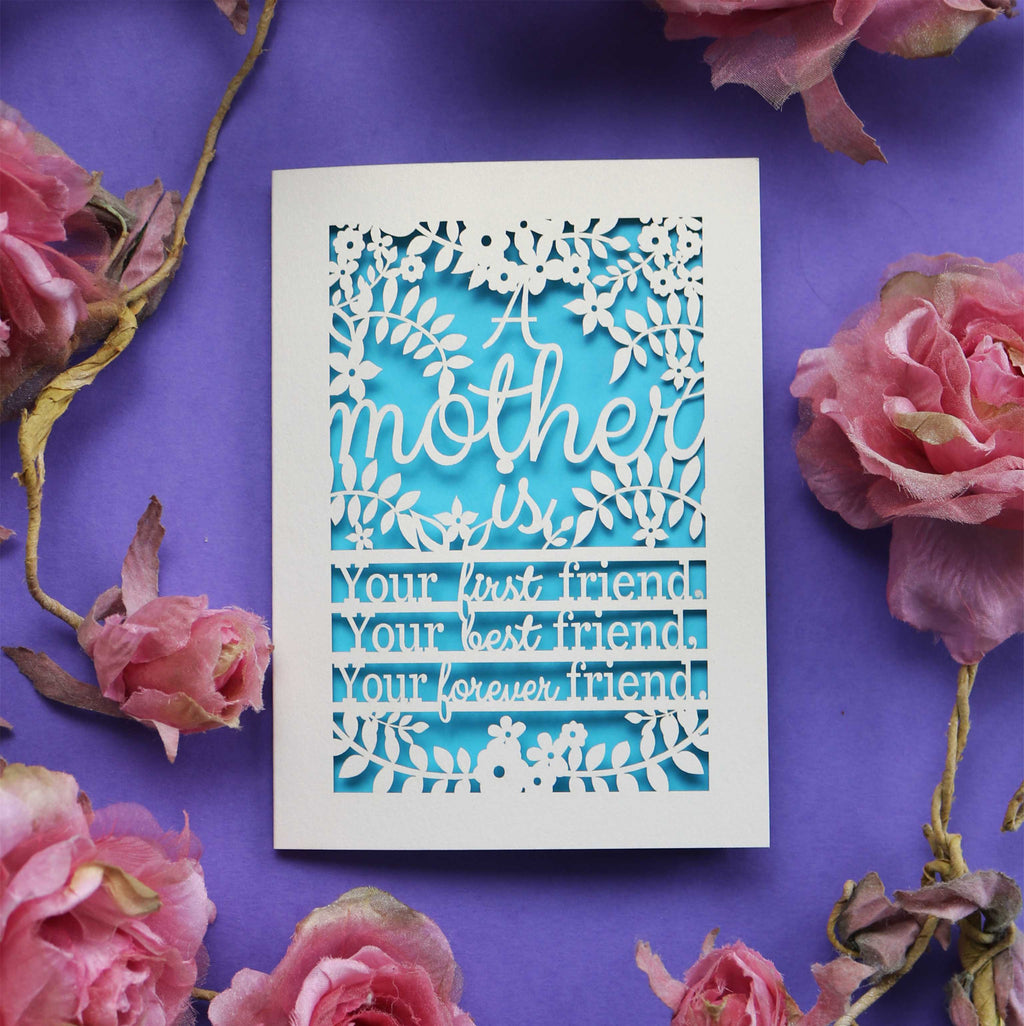 A laser cut mother card that says "A mother is your first friend, your best friend, your forever friend."