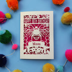 90th Birthday card with bee design and colourful pom-poms on a blue background