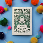 90th Birthday card with bee design and colourful pom-poms on a blue background