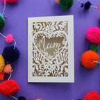 A mothers day card with the word "Mum" inside a heart