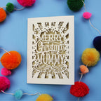 Unique laser cut Mummy Christmas card with 'Merry Christmas to my Mummy' text on a blue background with colourful pom-poms.