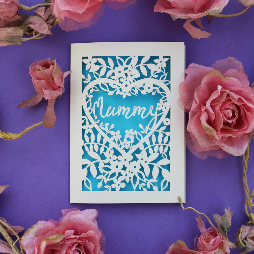A greetings card with the word "Mummy" in a script font inside a heart. 