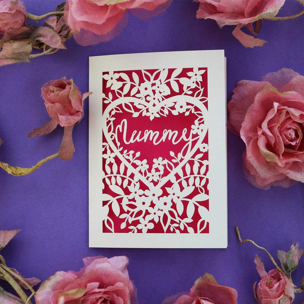 A cream and shocking pink "Mummy" card with flower border