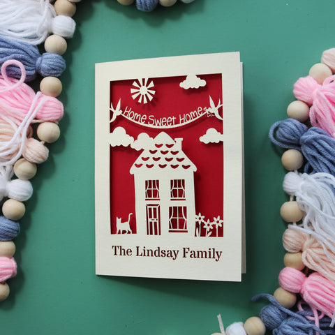 A first time house buyer card, laser cut and personalised - A6 / Dark Red