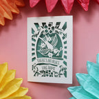 A special card for new home featuring a bird holding a key and the words "There's no place like home."