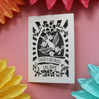 A housewarming card featuring a bird holding a key and the words "There's no place like home."