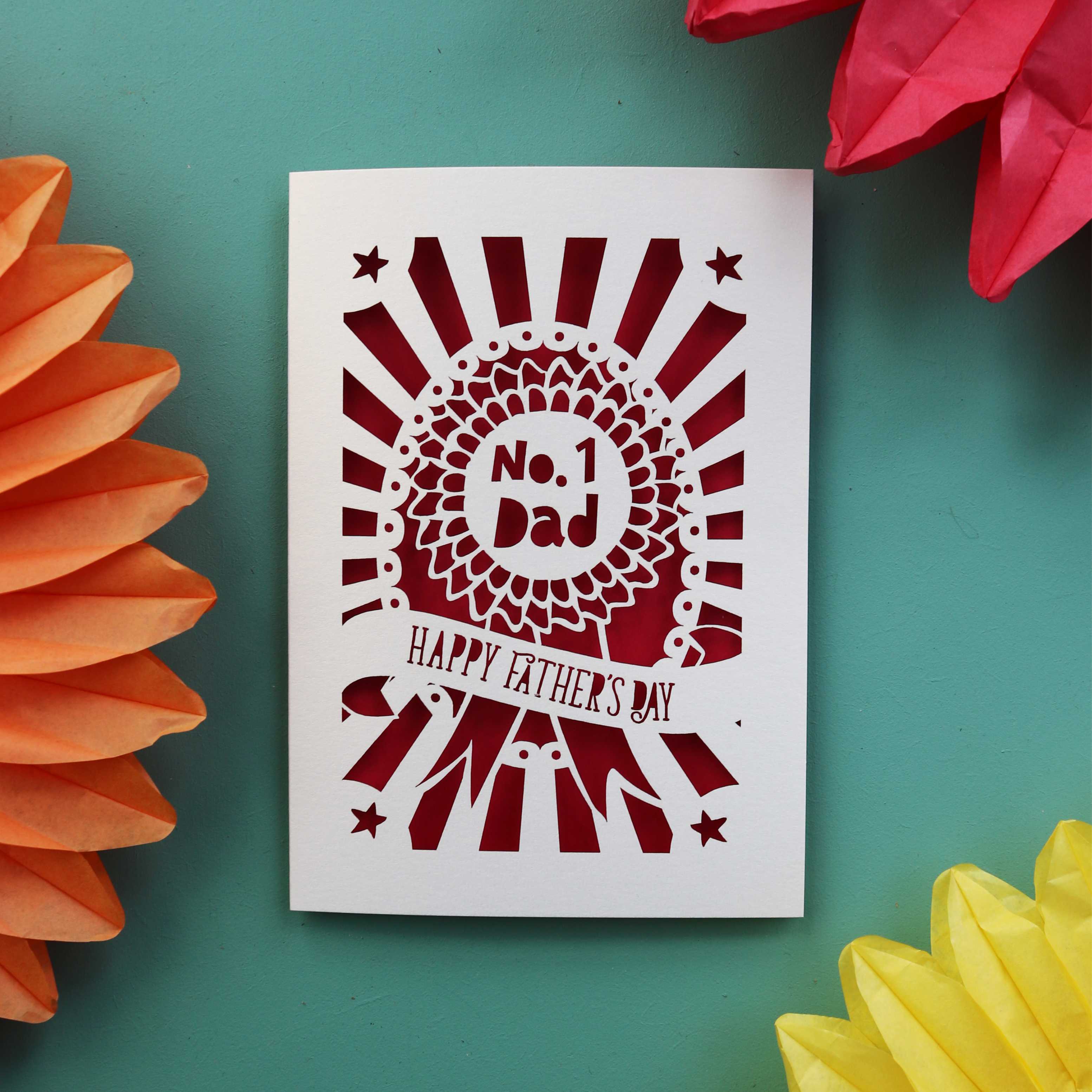 A Cream and red Laser cut Father's Day card featuring a rosette that says "No. 1 Dad" and "Happy Father's Day